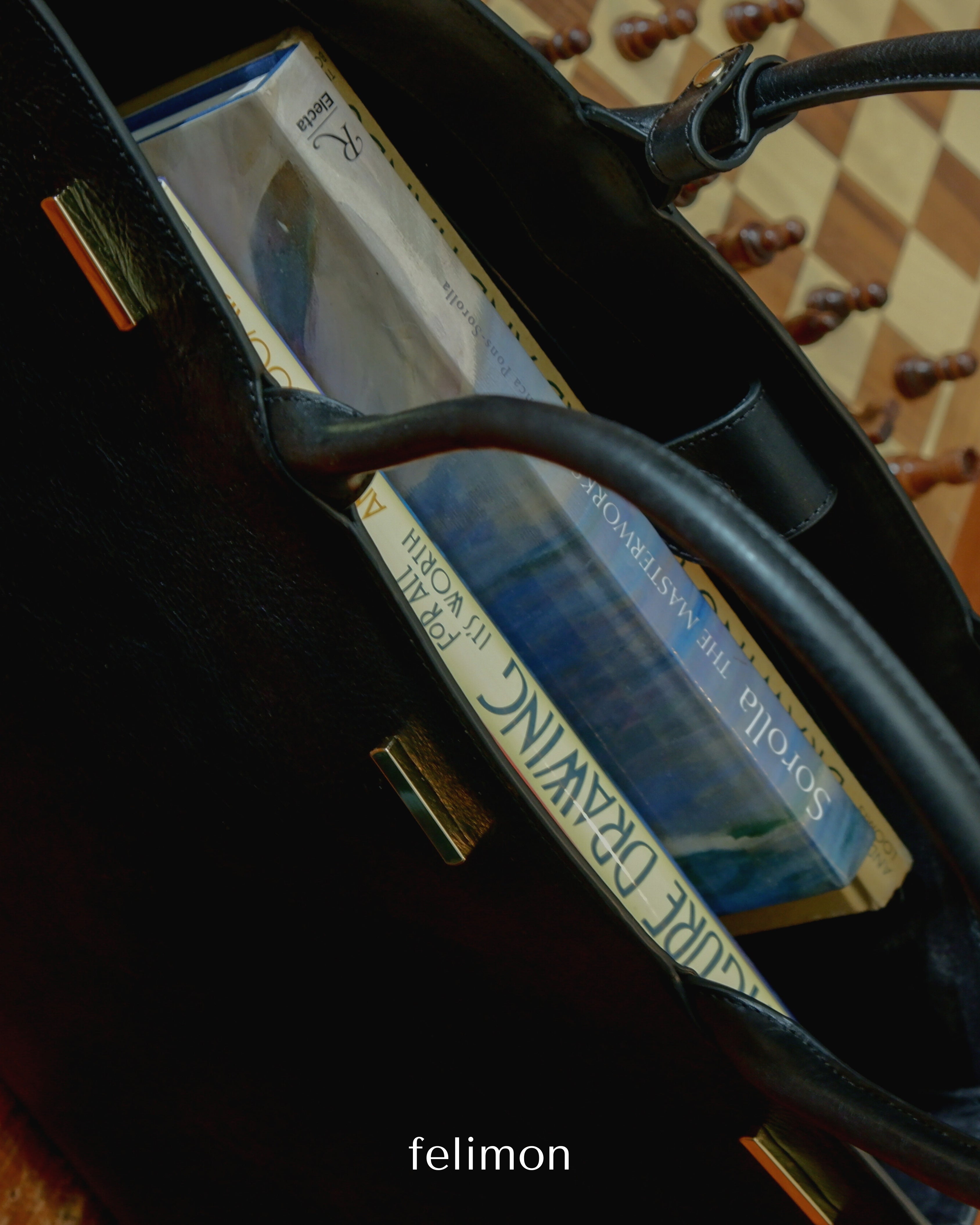 Black cowhide leather tote school and work bag with gold hardware — the Take Me With You carryall by Felimon, designed for everyday use and timeless style.